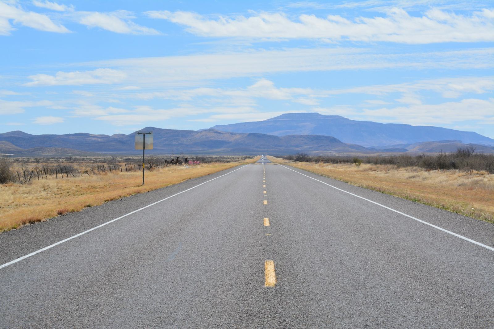Empty highway toward the mountains near Toyahvale, Texas