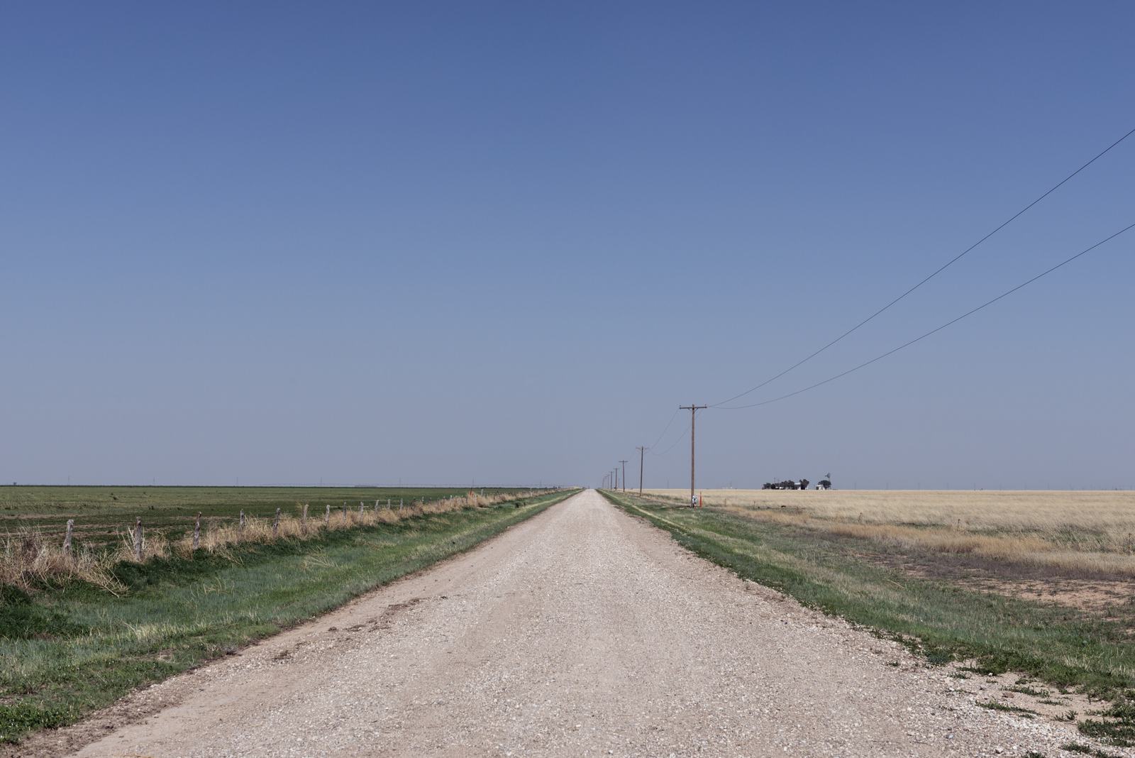 Gravel road stretching to the horizon in the Texas Panhandle